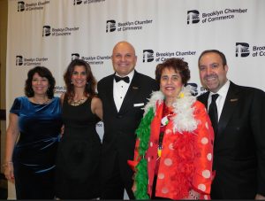 Denise Arbesu (left), chair of the Chamber’s Board of Directors, and Chamber President and CEO Carlo Scissura (right) made sure honoree Arthur Aidala, his sister Lori Bambina (second from left) and his mother Mary Ann Aidala received a Hollywood-style welcome. Eagle photo by Paula Katinas