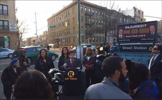 Councilmember Vincent Gentile (at podium) held a rally outside an R train station in Bay Ridge to call on the MTA to fix the subway line. Photo courtesy of Gentile’s office