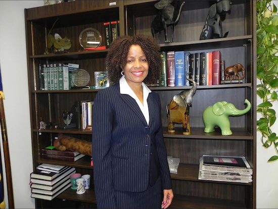 Acting Justice Carolyn E. Wade is pictured in her chambers, where she keeps her books and figurines shaped like elephants. Eagle photo by Paula Katinas