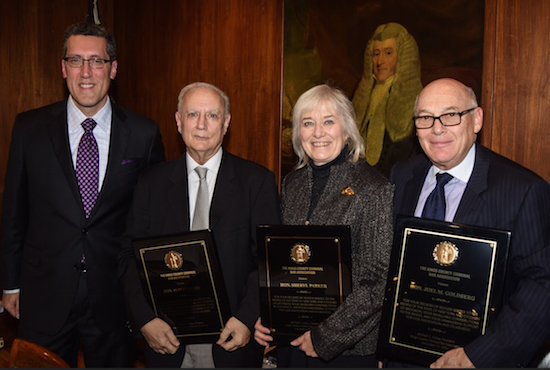 The Kings County Criminal Bar Association honored three retiring justices during its annual holiday party on Thursday night. Pictured from left: KCCBA President Michael Farkas, Hon. Albert Tomei, Hon. Sheryl Parker and Hon. Joel Goldberg. Eagle photos by Rob Abruzzese