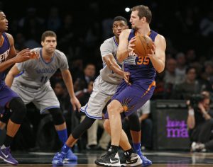 Bruce Ratner is reportedly selling his stakes in Barclays Center and the Brooklyn Nets, shown here as Brook Lopez (second from left) and his crew face off at home against the Phoenix Suns in a Dec. 1 game. AP Photo/Kathy Willens