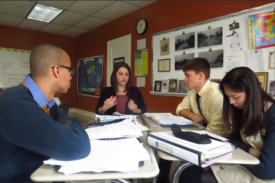 Doctoral candidate Katherine Perrotta guides students through a lesson. Photo courtesy of Adelphi Academy of Brooklyn