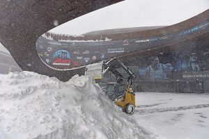 A plow piles up a huge mound of snow outside Brooklyn’s Barclays Center during Saturday’s storm. Now that the storm is over, what’s it going to cost the city to clean it all up? Photo by Andy Katz