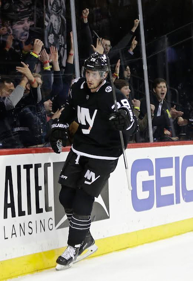 Brock Nelson gets the “hat trick” treatment from Islander fans at Downtown’s Barclays Center on Tuesday night after finishing off his first career three-goal game in the NHL. AP Photo
