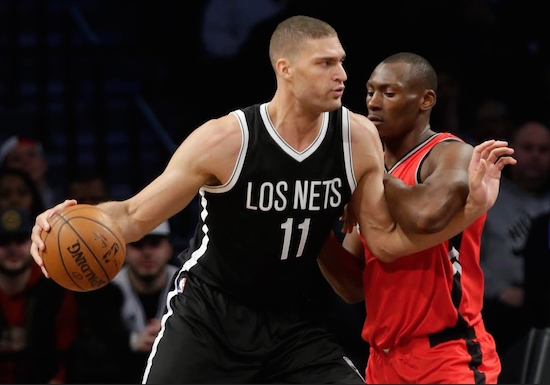 Donning black jerseys with “Los Nets” across the chest, Brook Lopez and the Nets suffered their eighth straight home loss to Atlantic Division-leading Toronto Wednesday night in Downtown Brooklyn. AP photo