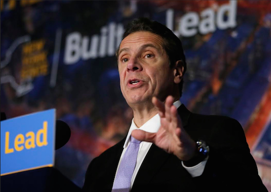 Governor Andrew Cuomo says building owners illegally de-regulated the apartments. AP Photo/Kathy Willens
