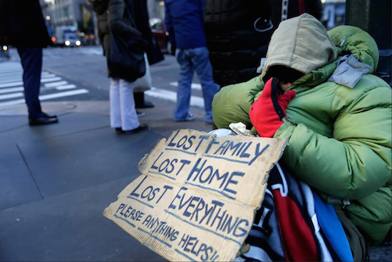 A homeless woman, who only wanted to be identified as Lala, asks for money on a street corner in Midtown Manhattan on Tuesday. As New York City grapples with its homelessness crisis, many of those sleeping on the street have said they'd prefer to be outside than contend with the city's at-times overburdened, dirty and even dangerous shelter system. AP Photo/Seth Wenig