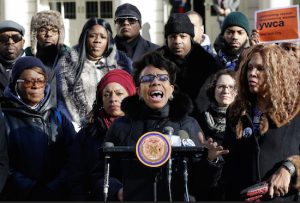 On Monday, New York City Councilmember Laurie Cumbo, center, standing on the steps of City Hall with women's rights activists, criticized Police Commissioner William Bratton's response to women who have been sexually assaulted in taxi cabs. AP Photo/Mark Lennihan