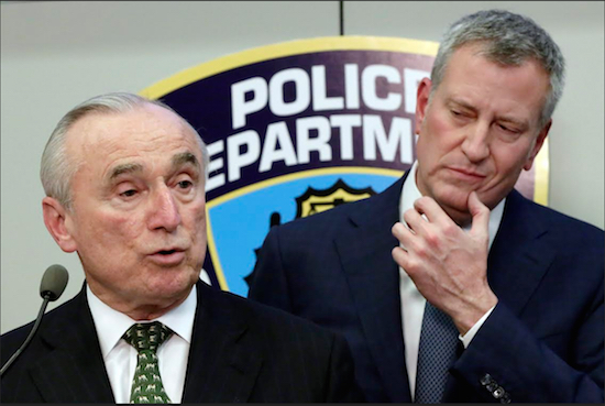 New York City Police Commissioner William Bratton discusses crime statistics as Mayor Bill de Blasio, right, listens during a news conference at police headquarters in New York on Monday. Arrests were down more than 56,000 in the past two years, according to preliminary annual statistics released Monday. AP Photo/Richard Drew
