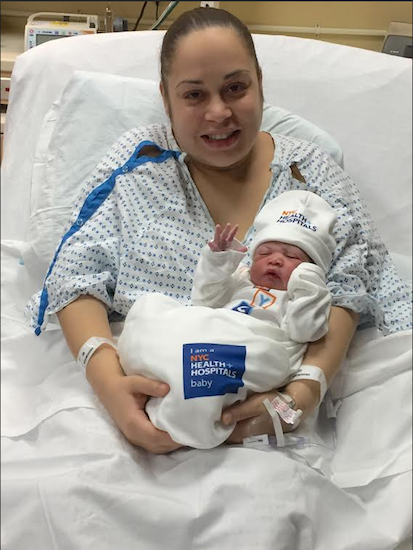 Proud mom Stephanie Diaz introduces her baby boy, Zayden Noel, to his first photo op. Photo courtesy of NYC Health + Hospitals Corp