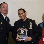Crime is down in the 84th Precinct thanks to cops like Ywoeh Alrubyai (center), who was named the 84th Precinct Community Council’s Cop of the Month for his effort in helping to get a loaded gun off the streets. Deputy Inspector Sergio Centa (left) and 84th Precinct Community Council President Leslie Lewis presented Alrubyai with his award. Eagle photo by Rob Abruzzese