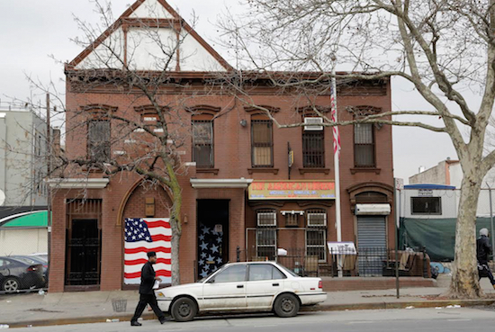 A man walks to his car in front of an American Legion Post in Brooklyn on Feb. 9, 2016. A military author says it’s time to find precisely where scores of Maryland soldiers are buried in the city so a monument can be erected on the spot to honor their sacrifice during the American Revolution, when they saved Gen. George Washington’s army from defeat 240 years ago this summer. The soldiers are believed to be buried in the vicinity of the building. AP Photo/Mark Lennihan