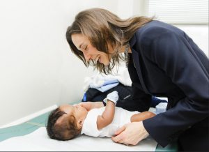 Dr. Caitlin Hoffman, a pediatric neurosurgeon, conducts a patient examination at New York Methodist Hospital. Photo courtesy of New York Methodist