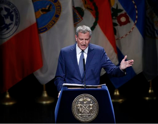 New York Mayor Bill de Blasio gestures during the his third State of the City address, Thursday at Lehman College in the Bronx. AP Photo/Kathy Willens