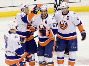 The Islanders celebrate an early goal by Frans Nielsen (center) as they cruised to a 4-1 victory in Minnesota Tuesday night, improving to 2-0 on their seven-game Circus Trip. AP photo