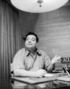 Comedian Jackie Gleason gestures at news conference in January, 1956 in New York. AP Photo/John Rooney