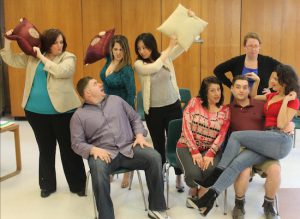 The cast gets playful during a rehearsal. Photo courtesy of Narrows Community Theater