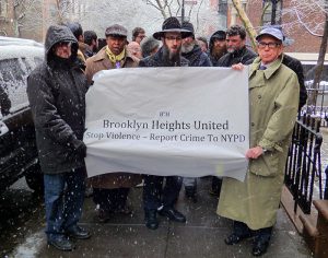 (Left to right) A member of Congregation B’nai Avraham, Borough President Eric Adams, Rabbi Aaron Raskin, Father John Lardas of the Cathedral of Sts. Constantine and Helen and attorney Sanford Rubenstein were among those who took part in Raskin’s march against violence in Brooklyn Heights on Friday. Photo by Mary Frost