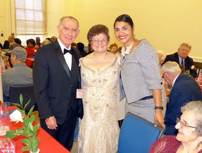 Sal and Maria Puma, married 52 years, received a hand from Deputy BP Diana Reyna for their fabulous formal wear.  Photos by Mary Frost