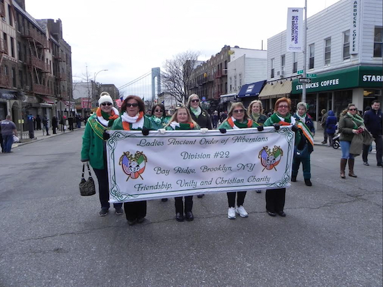 Members of the Ladies Ancient Order of Hibernians (Division 22) proudly display their banner. Eagle photos by Paula Katinas
