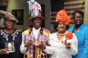 The hat contest winners (from left): Diann Davis took second place, Heywood Thomas placed third and Alice Wiley won first place (with Roxanne Persaud). Eagle photos by Rob Abruzzese