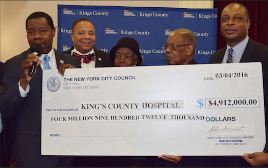 Councilmember Mathieu Eugene (left), state Sen. Jesse Hamilton (second from left) and other officials present a check to King's County Hospital officials. Photo courtesy of Eugene’s office