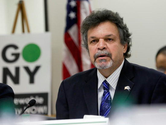 Assemblymember Felix Ortiz (D-Brooklyn) speaks during a public forum on climate change on Monday in Albany. Nearly two dozen state lawmakers want New York's public pension fund to drop stock holdings in oil, natural gas and coal companies as part of a movement against global warming. AP Photo/Mike Groll