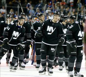 Anders Lee is front and center during the post-game celebration at Barclays Center on Tuesday night as the Islanders pulled out a much-needed 2-1 shootout win over the visiting Carolina Hurricanes. AP photo