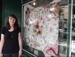 Artist Margaux Walter took part in last year’s exhibition, displaying her multi-layered photo in the front window of Enchanted Florist on Fifth Avenue. Eagle file photo by Paula Katinas