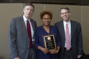 Shauntina "Tina" Jones (center) was honored as the Brooklyn Supreme Court Employee of the Year by her supervisor Dan Leary (left) and Administrative Judge Lawrence Knipel during a ceremony at the courthouse on Tuesday, March 22. Photos by Roderick Randall