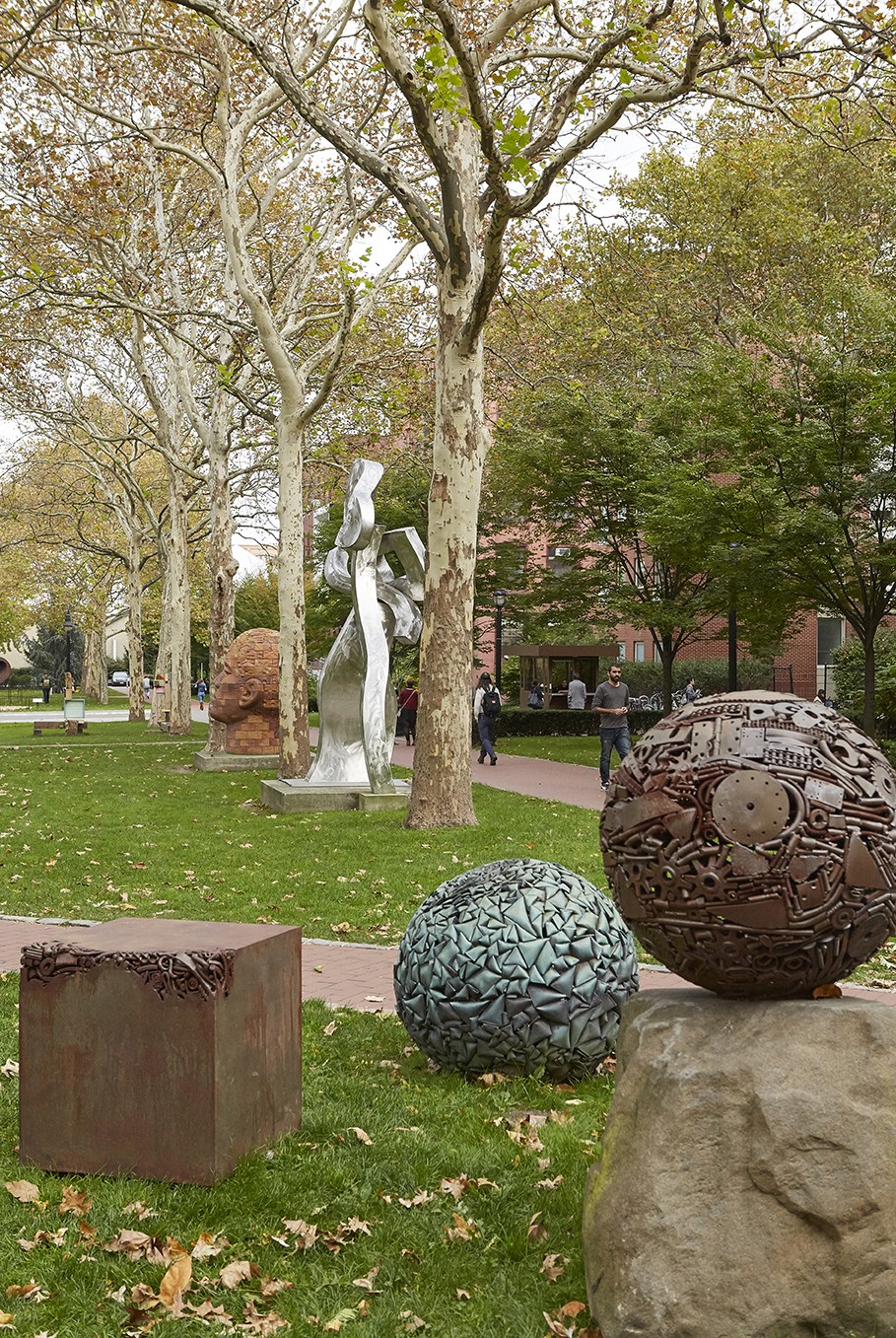 A number of sculptures in juxtaposition, including, on the far right, a work by Michael Malpass.