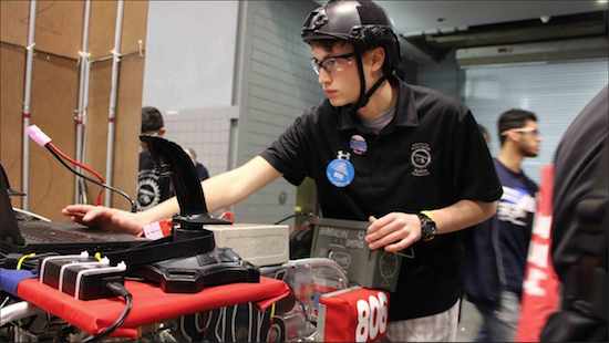 Junior John Paul Cashman puts his talent on display in the robotics competition. Photo courtesy of Xaverian High School