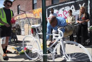 Brooklyn Borough President Eric Adams laid flowers down at the ghost bike memorial, set up by the nonprofit advocacy organization Transportation Alternatives, for 34-year-old Lauren Davis, who was killed in a bike crash at the intersection of Classon and Lexington avenues in Clinton Hill. Photo: Patrick Rheaume/Brooklyn BP’s Office
