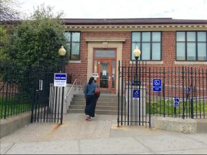 A voter arrives at the Brooklyn Public Library's Fort Hamilton Branch on Fourth Avenue in Bay Ridge. Eagle photo by Lore Croghan