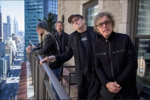 Members of Cheap Trick (from left) Robin Zander, Daxx Nielsen, Rick Nielsen and Tom Petersson pose for a portrait in New York to promote their new album "Bang Zoom Crazy…Hello." The band will perform with former member Bun E. Carlos at their Rock and Roll Hall of Fame induction ceremony on Friday in Brooklyn. Photo by Drew Gurian/Invision/AP