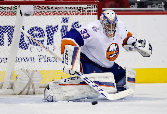 Rookie goalie Christopher Gibson made a game-saving save in overtime en route to his first win as the Islanders beat the Capitals, 4-3, Tuesday to wrap up a postseason spot. AP photo