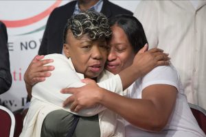 In this July 26, 2014 file photo, Gwen Carr, mother of Eric Garner, left, and his sister Ellisha Garner, hug during a rally in New York. This past weekend, Carr and other mothers who have lost their children to gun violence or after contact with the police addressed a crowd at Mount Ararat Church in Brooklyn. AP Photo/John Minchillo, File