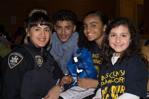 Court officer Cynthia Bostick with her kids Joshua E. Naranjo and Jasmine A. Bostick with Gabrielle Rago (daughter of court officer Jerry Rago, not pictured).