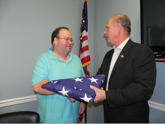 “You father earned this flag,” U.S. Rep. Dan Donovan (right) told Tom Joyce at the presentation. Eagle photo by Paula Katinas