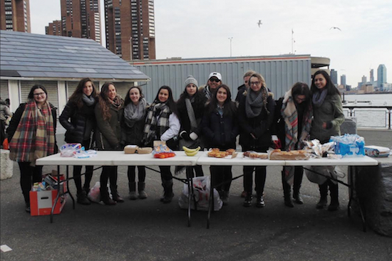 Students from Fontbonne Hall Academy set up a table to help people in need of food and clothing. Photo courtesy of Fontbonne Hall