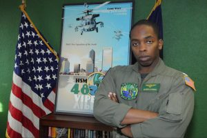 Lt. Olufemi Lawrence is part of a squadron that flies the Navy’s most technologically-advanced helicopter. Photo courtesy of the U.S. Navy
