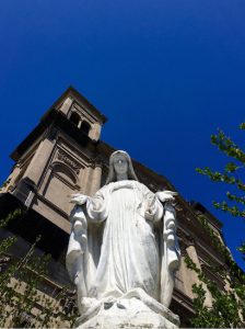 The statue of Our Lady of Loreto stands tall before the shuttered Ocean Hill church that bears her name. Eagle photos by Lore Croghan
