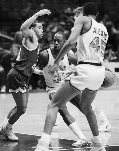 In this March 6, 1986 file photo, Dwayne "Pearl" Washington (31) of Syracuse University drives around Dana Barros (21) of Boston College during the Big East tournament at New York's Madison Square Garden. Washington, who went from New York City playground wonder to Big East star for Jim Boeheim at Syracuse, has died. He was 52. Washington died Wednesday of cancer, the university said. AP Photo/Richard Drew, File