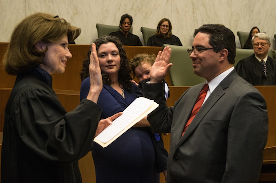 Hon. Steven L. Tiscione was sworn in as the newest magistrate judge for the Eastern District of New York by Hon. Reena Raggi during his investiture ceremony, with his wife Lisa Beneventano, and son Massimo Tiscione looking on. Eagle photos by Rob Abruzzese