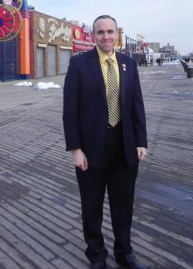 Councilmember Mark Treyger, pictured on the Riegelmann Boardwalk earlier this year, says 48 of his colleagues have signed onto his effort to landmark the iconic structure. Eagle file photo by Paula Katinas