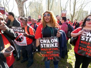 Hundreds of striking Verizon workers chanted, “No contract, no FIOS!” at a rally in Cadman Plaza Park on Thursday, one of many protests staged across the city since 36,000 Communications Workers of America union members went on strike on Wednesday. Photo by Mary Frost