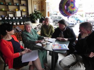 Jane Kelly (second from left) enjoys a cup of coffee with Judith Grimaldi, Pierre Lehu, Marianne Nicolosi and Todd Fliedner (left to right) as they discuss a new senior citizen survey. Eagle photo by Paula Katinas