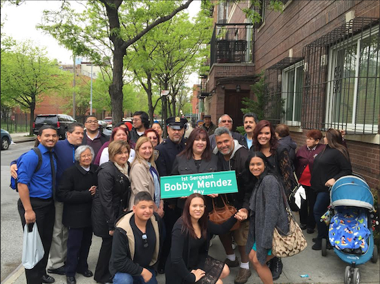 The family and friends of the late Bobby Mendez proudly display the new street sign. Photos courtesy of Councilmember Stephen Levin’s office