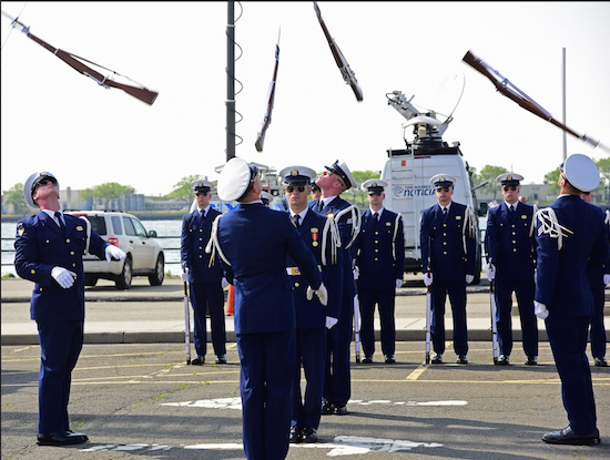 Rifles are suspended overhead above the U.S. Coast Guard Ceremonial Honor Guard. ﻿Eagle ﻿photos by Andy Katz