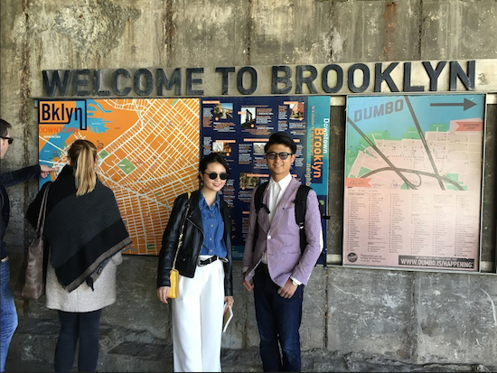 Two tourists from Tokyo, Japan pose in front of a “Welcome to Brooklyn” sign under the Brooklyn Bridge. Eagle photos by Scott Enman